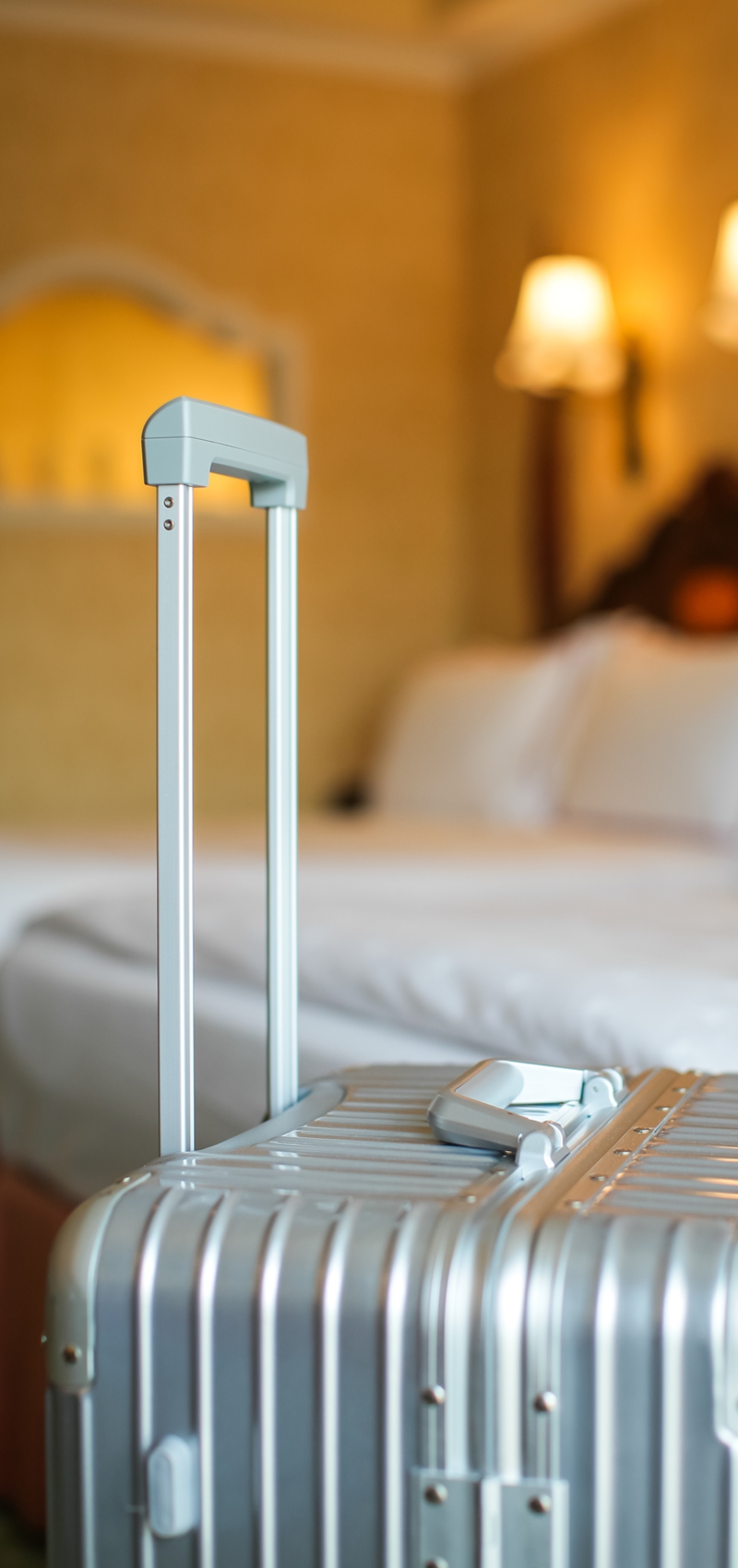 close-up-suitcase-by-bed-home